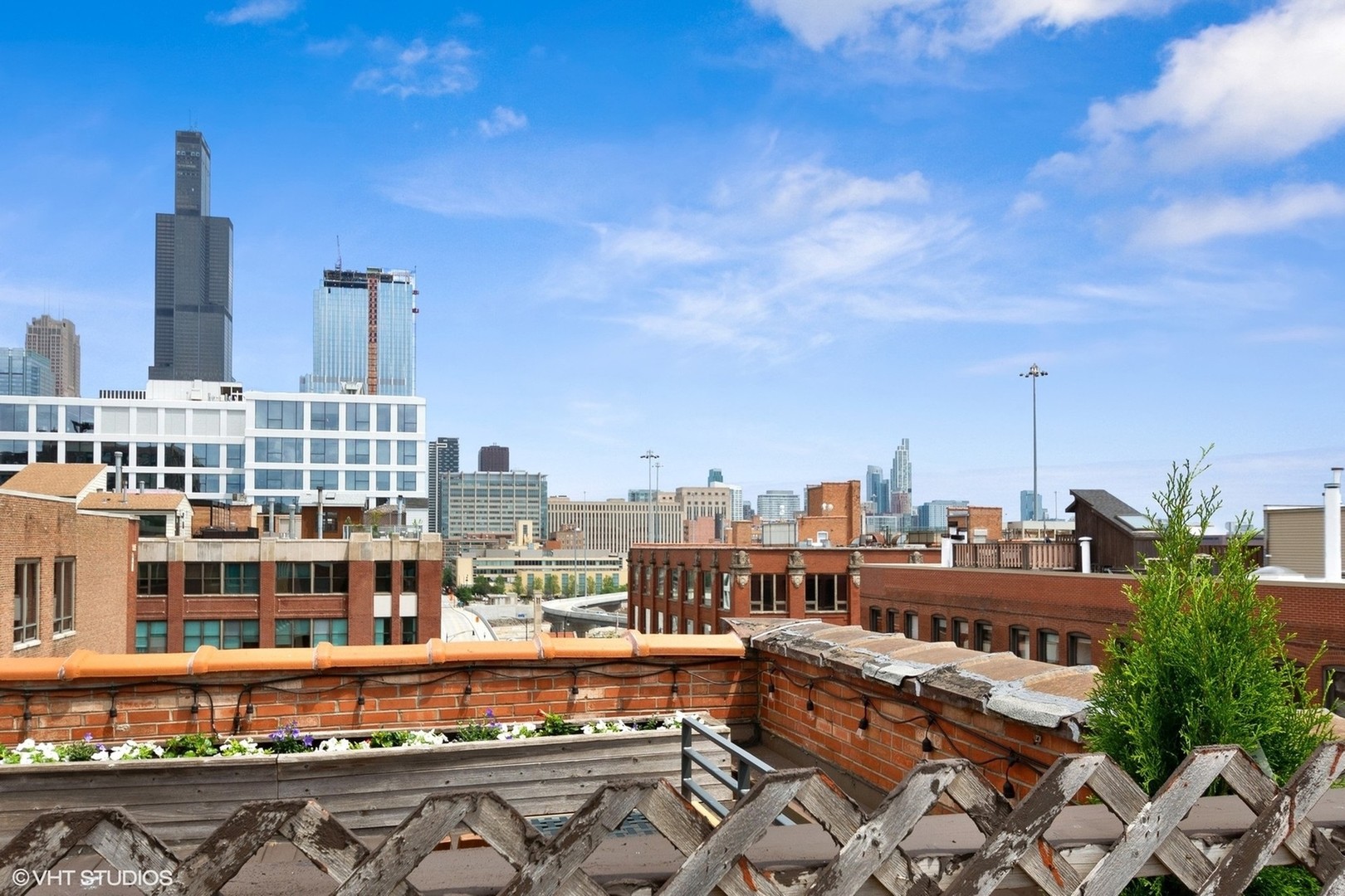 331 South Peoria Street, Unit PH6 Chicago, IL 60607 - Photo 41 of 46 a view of city with tall buildings