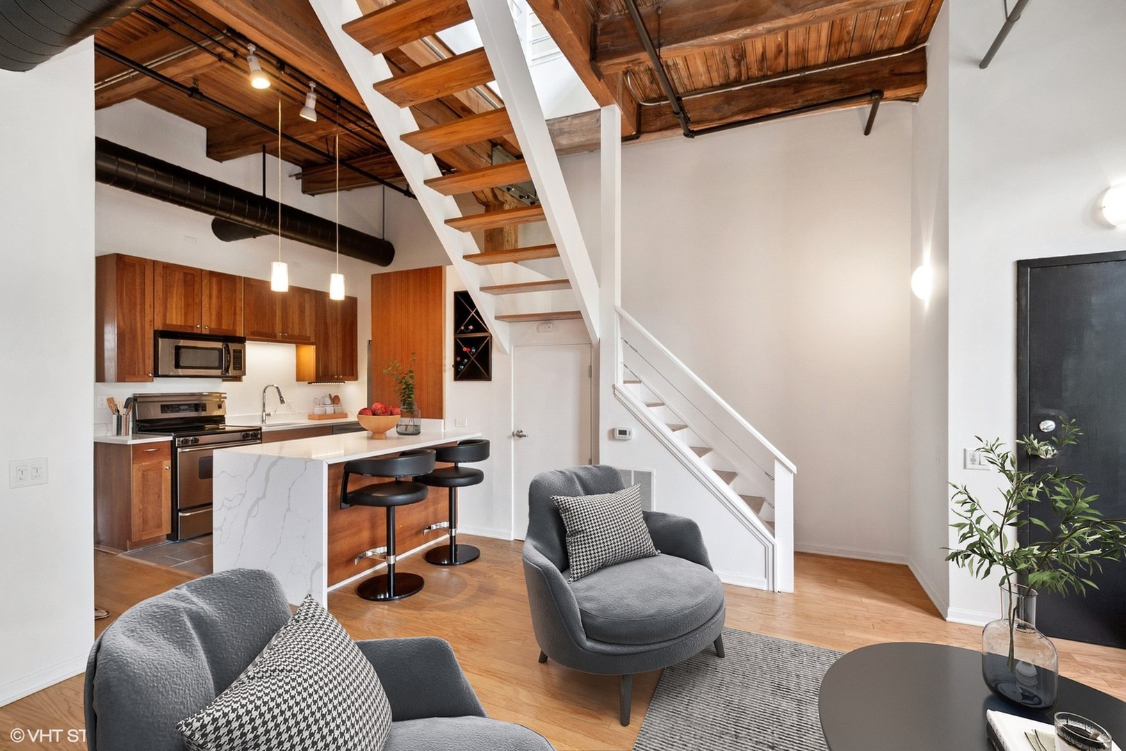 331 South Peoria Street, Unit PH6 Chicago, IL 60607 - Photo 8 of 46 a living room with furniture and a flat screen tv