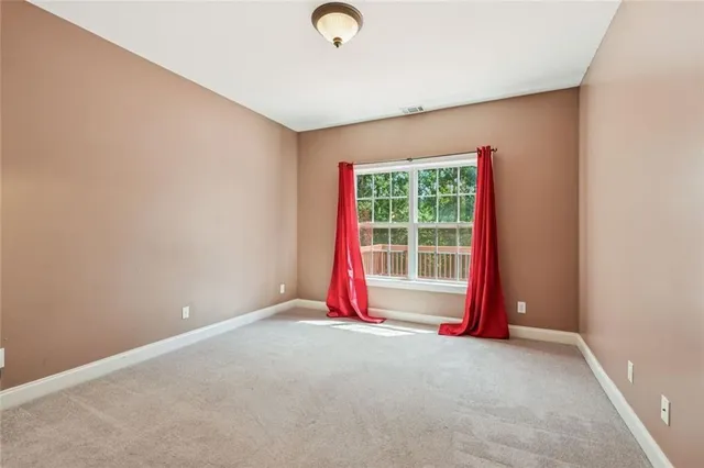a view of livingroom with wooden floor and floor to ceiling window