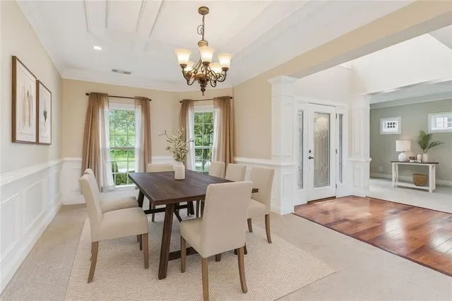 a view of a dining room with furniture window and outside view