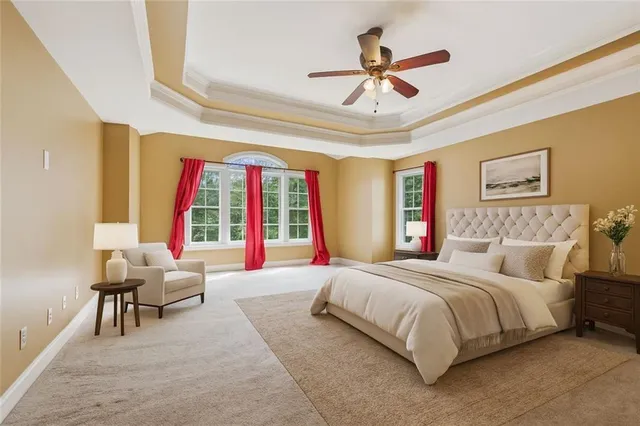 a bedroom with a bed furniture and a large window