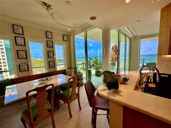 a dining room with furniture and window