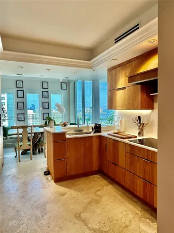 a view of a living room with furniture and a potted plant