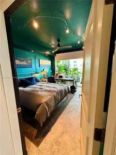 a kitchen with a sink and a refrigerator