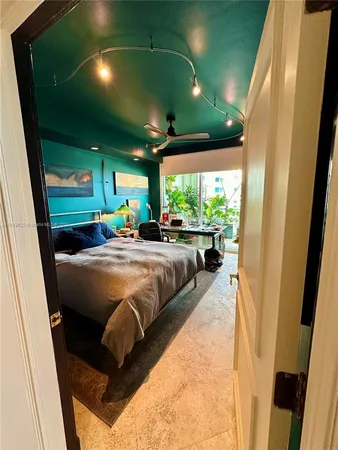 a kitchen with a sink and a refrigerator