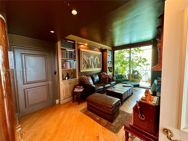 a living room with furniture fireplace and flat screen tv