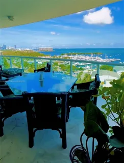 a view of a chairs and table in the patio