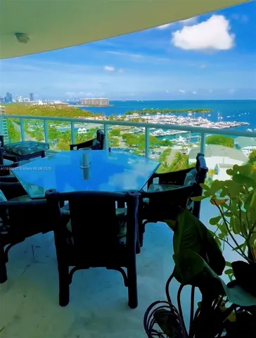 a view of a chairs and table in the patio
