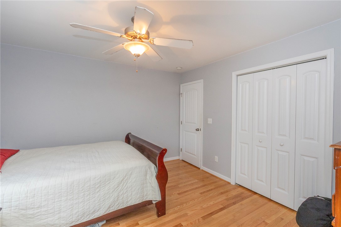 861 North Old Pendleton Road Liberty, SC 29657 - Photo 24 of 45 Hardwood floors and a ceiling fan create a comfortable and inviting atmosphere in this room.