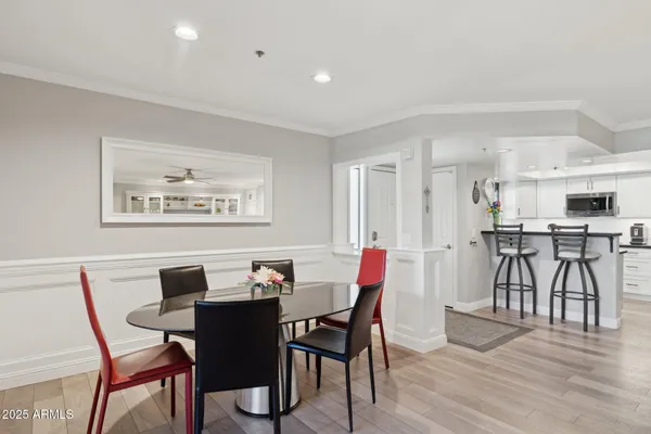 a view of a dining room with furniture and wooden floor