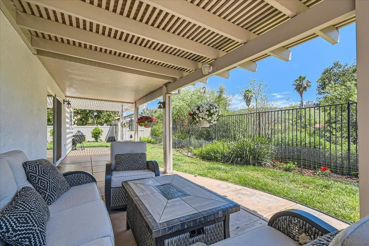 12709 Oak Knoll Road Poway, CA 92064 - Photo 29 of 36 a patio with yard table and chairs