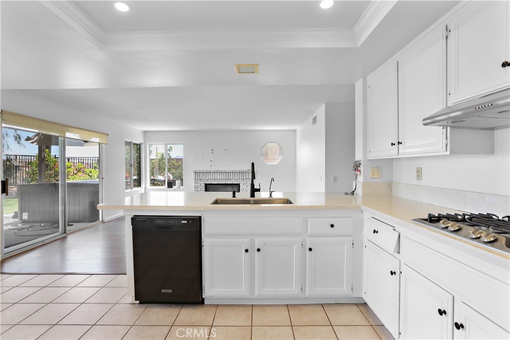 17316 Cold Spring Circle Riverside, CA 92503 - Photo 11 of 46 a kitchen with granite countertop white cabinets and white appliances