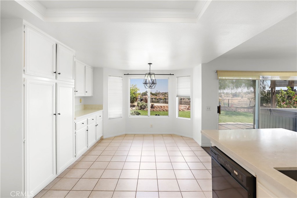 17316 Cold Spring Circle Riverside, CA 92503 - Photo 15 of 46 a kitchen with granite countertop a stove a sink and a refrigerator