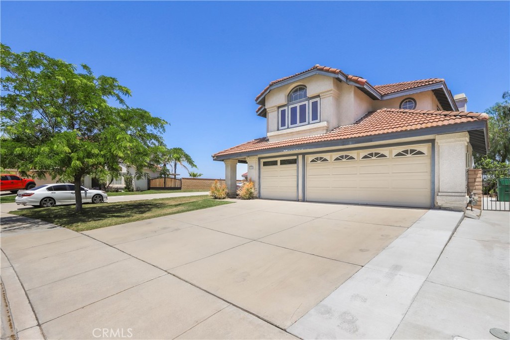 17316 Cold Spring Circle Riverside, CA 92503 - Photo 2 of 46 a front view of a house with a yard and garage