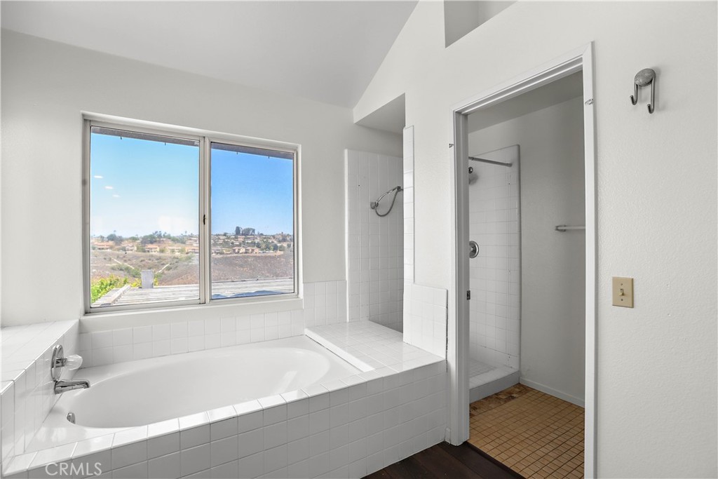 17316 Cold Spring Circle Riverside, CA 92503 - Photo 30 of 46 a bathroom with a tub and shower