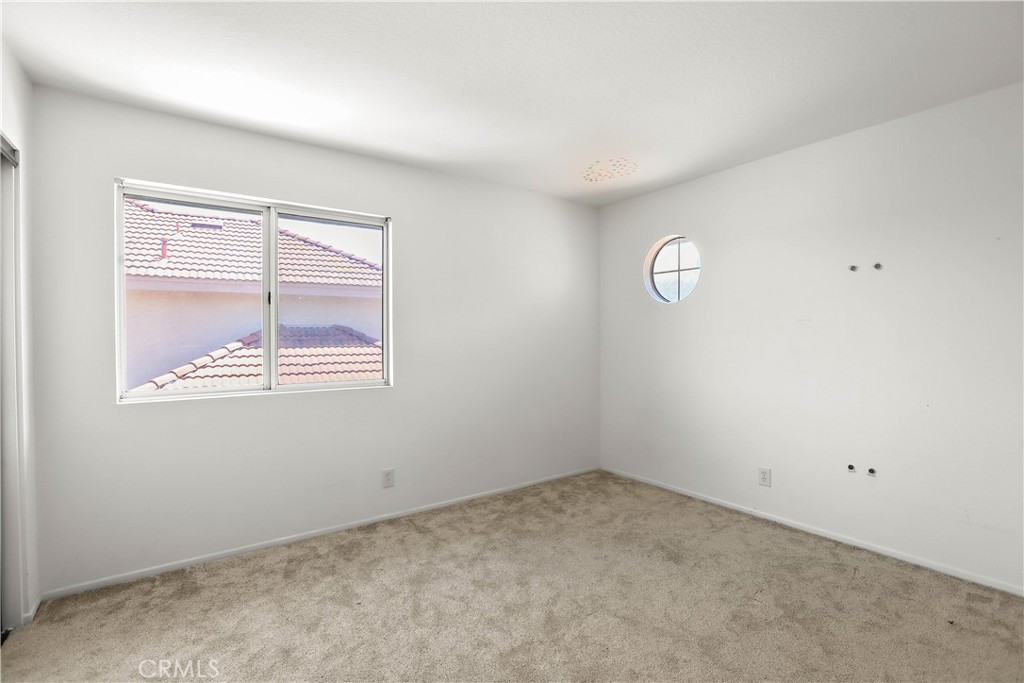 17316 Cold Spring Circle Riverside, CA 92503 - Photo 34 of 46 an empty room with a window