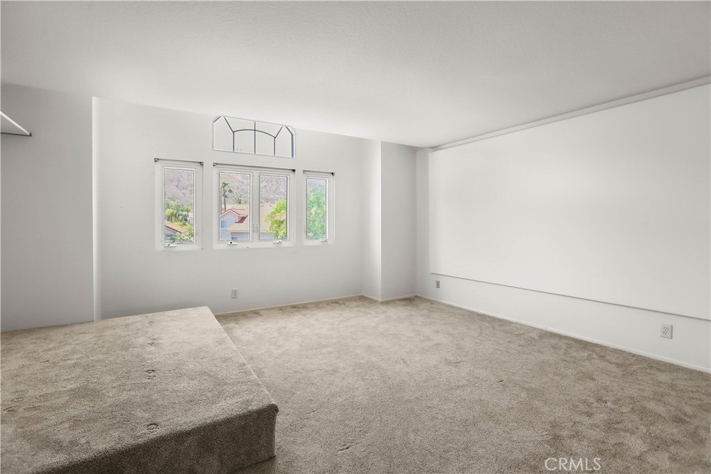 17316 Cold Spring Circle Riverside, CA 92503 - Photo 37 of 46 an empty room with windows and closet