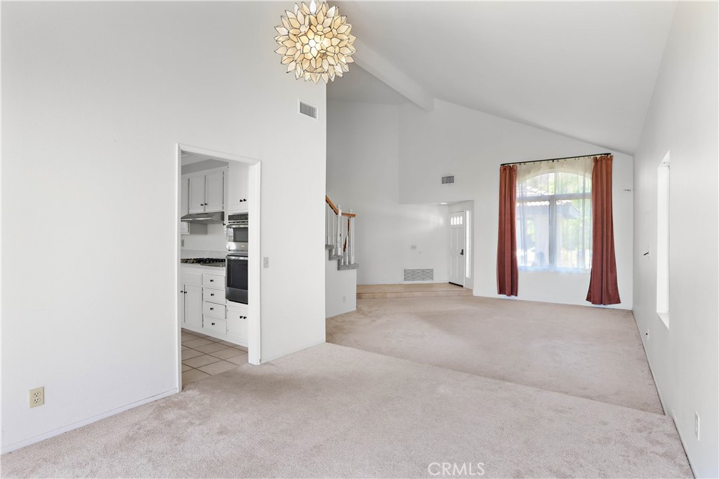 17316 Cold Spring Circle Riverside, CA 92503 - Photo 10 of 46 a view of a hallway with a chandelier