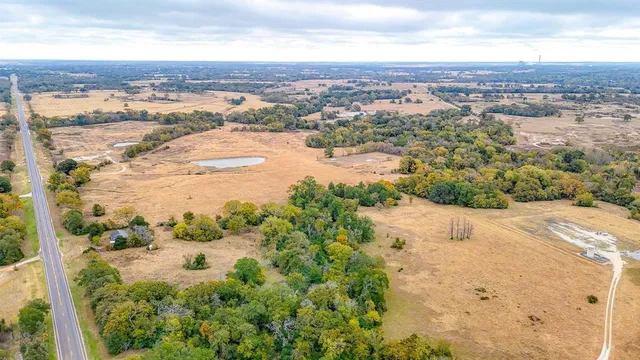 an aerial view of ocean with beach