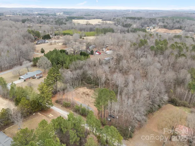 an aerial view of mountain with trees around