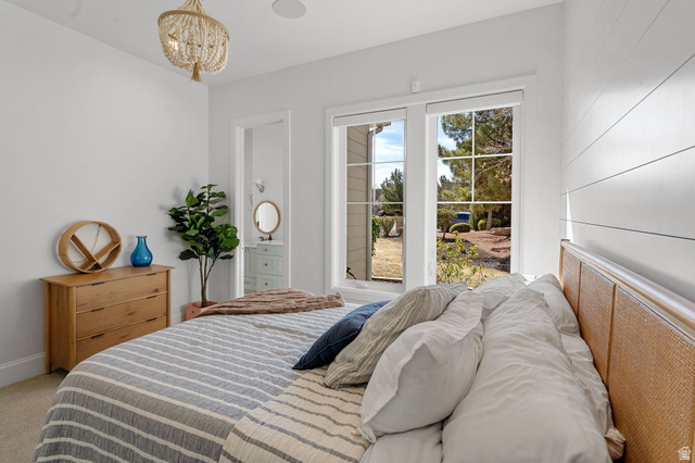 2917 Old Farm Road Washington, UT 84780 - Photo 63 of 105 Bedroom featuring a chandelier and carpet