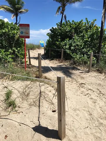 a view of a bench in the patio in front of a house