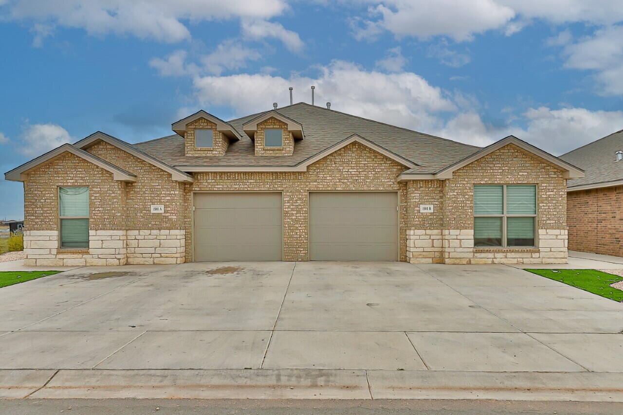 1901 Langford Avenue, Unit B Lubbock, TX 79407 - Photo 1 of 11 front view of a house with a garden