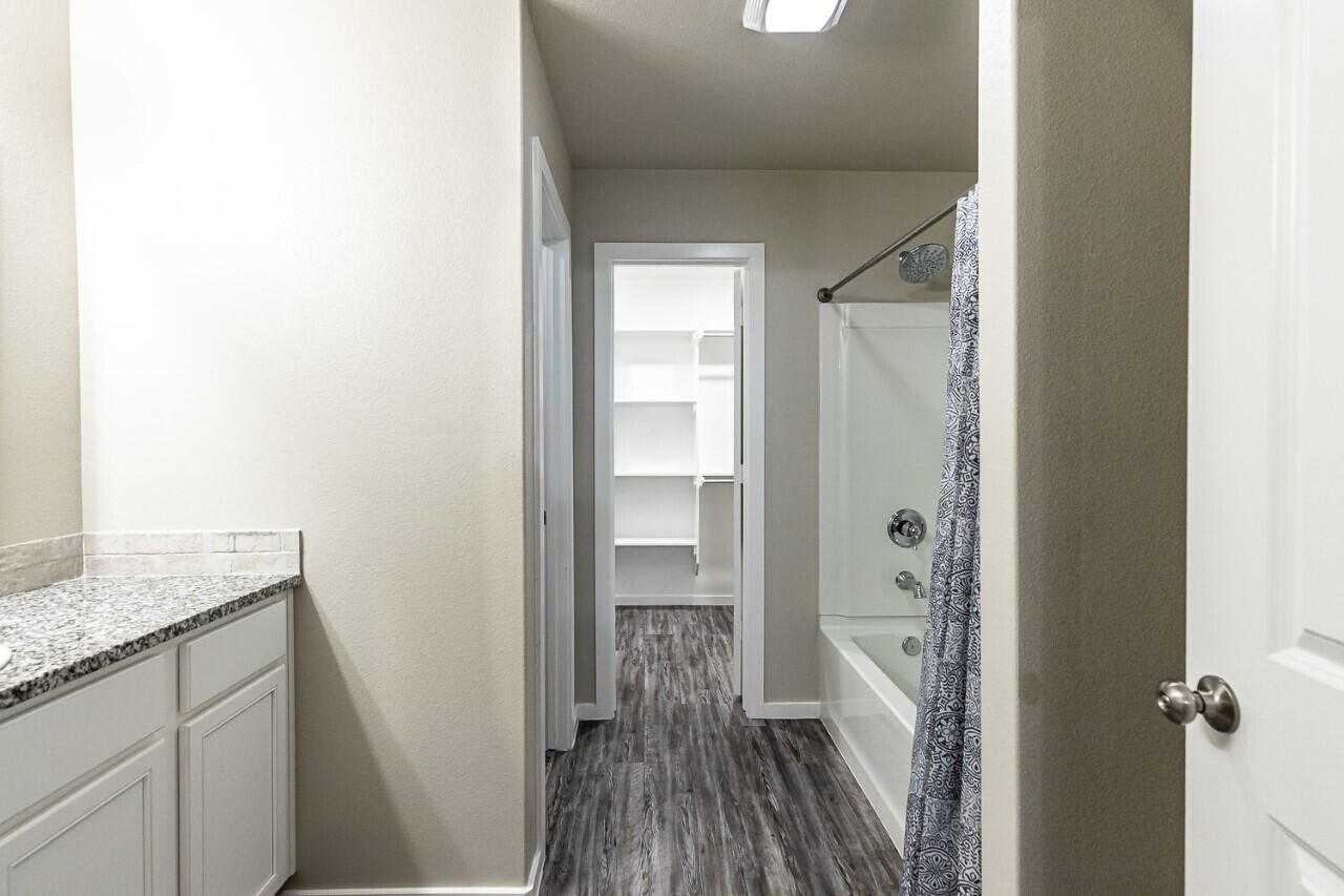 1901 Langford Avenue, Unit B Lubbock, TX 79407 - Photo 9 of 11 a view of a bathroom from a hallway
