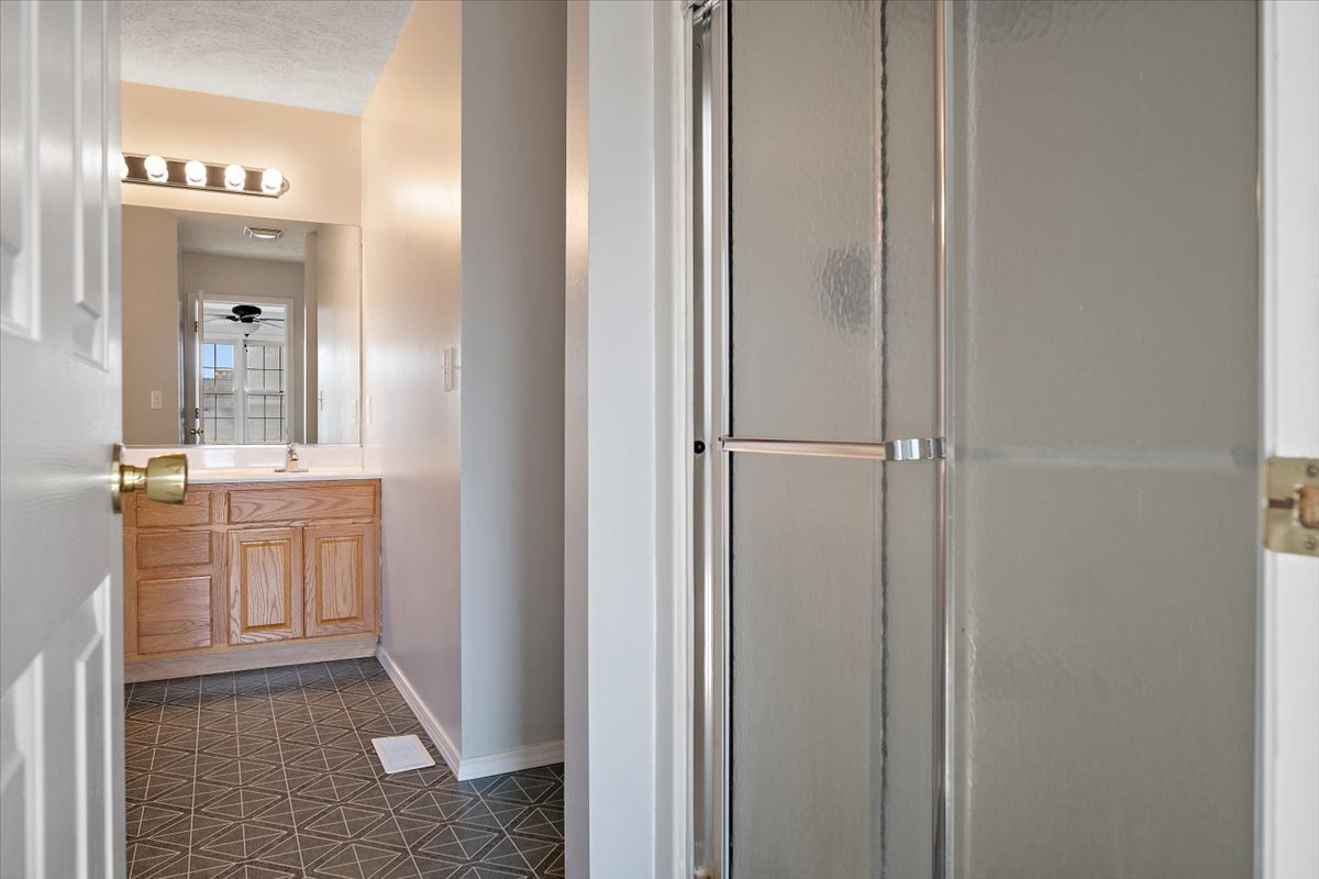 606 Windward Way Heyworth, IL 61745 - Photo 12 of 30 a bathroom with a granite countertop sink and a mirror
