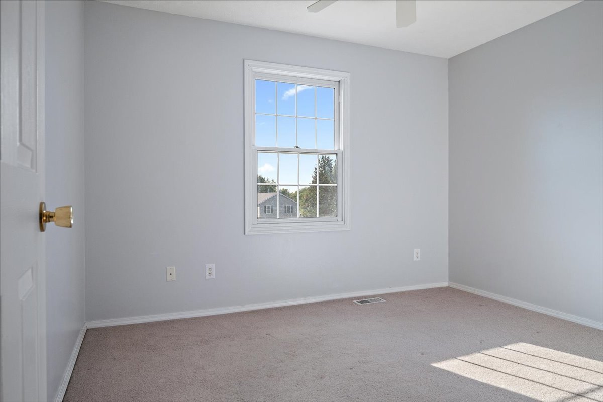 606 Windward Way Heyworth, IL 61745 - Photo 17 of 30 a view of an empty room with a window
