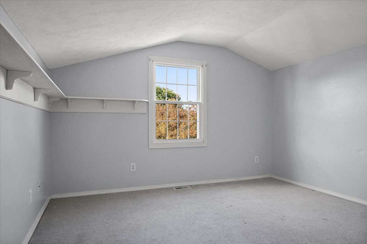 606 Windward Way Heyworth, IL 61745 - Photo 19 of 30 an empty room with a window