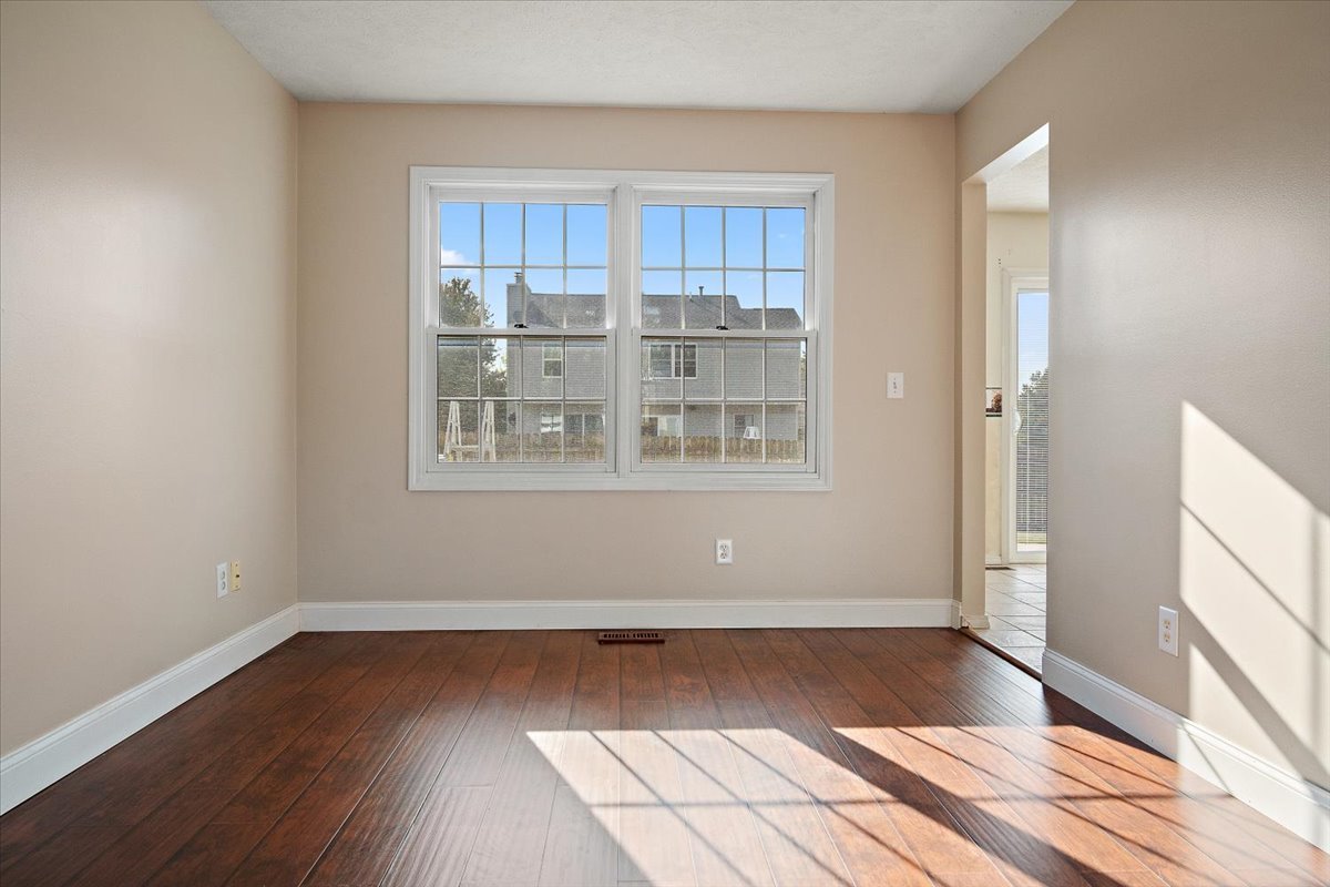 606 Windward Way Heyworth, IL 61745 - Photo 6 of 30 a view of wooden floor and windows in a room
