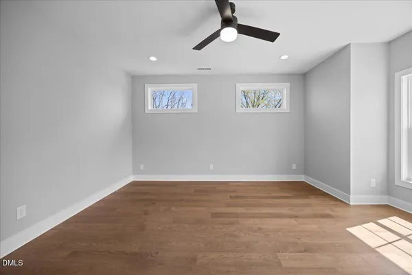 a view of an entryway with wooden floor