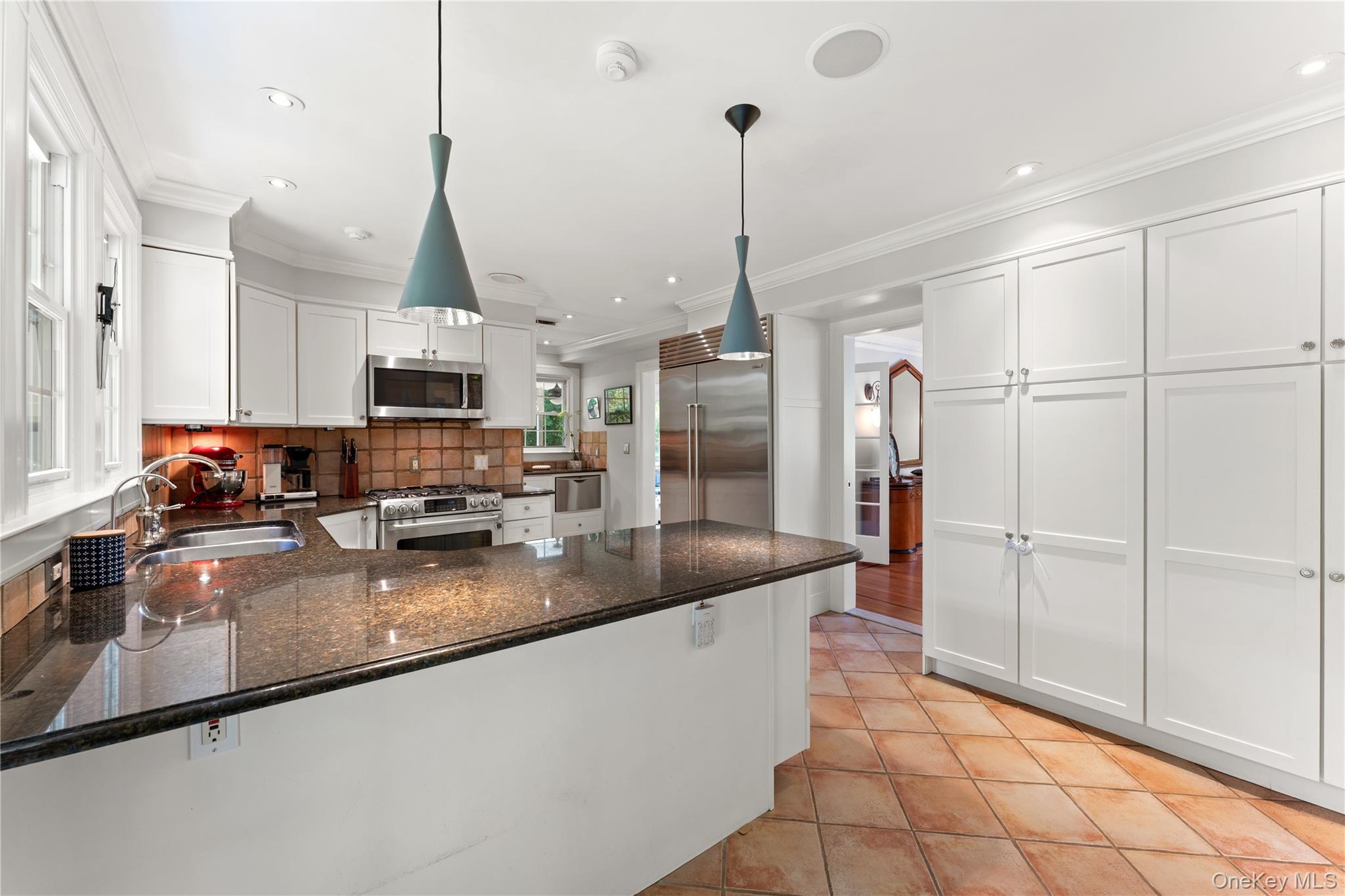 2 Dellwood Road Bronxville, NY 10708 - Photo 9 of 36 Dine-In Kitchen featuring stainless steel appliances, granite countertops, two sinks, custom cabinetry and access to the yard via the French Door.