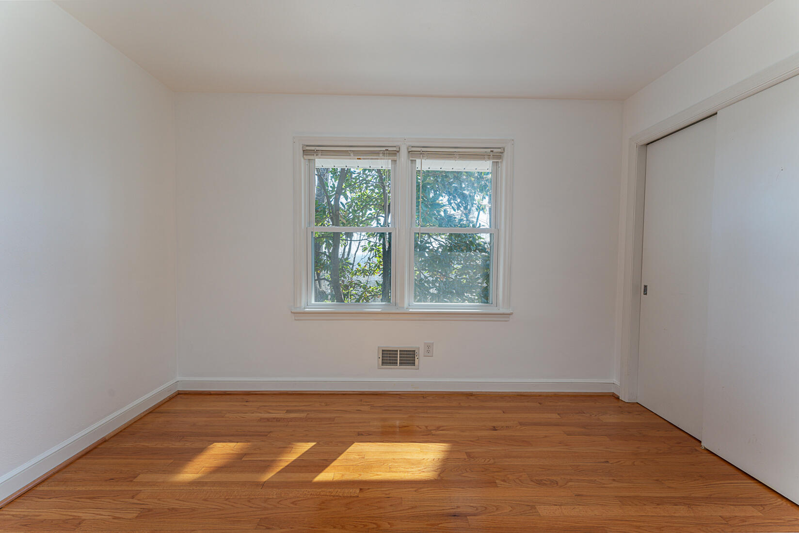 724 Eddies Road Salem, VA 24153 - Photo 22 of 54 a view of a room with a window and wooden floor