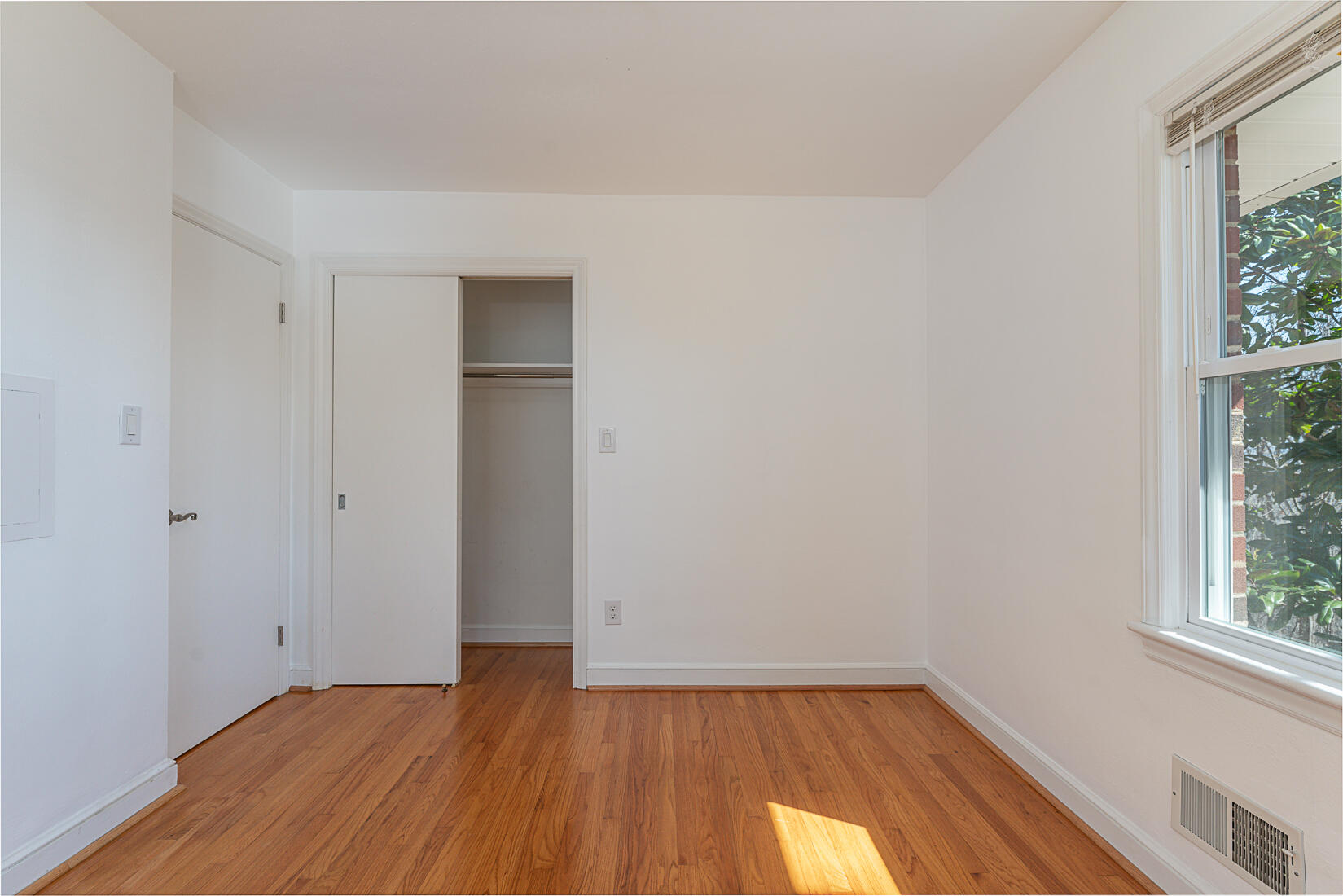724 Eddies Road Salem, VA 24153 - Photo 29 of 54 a view of an empty room with wooden floor and a window