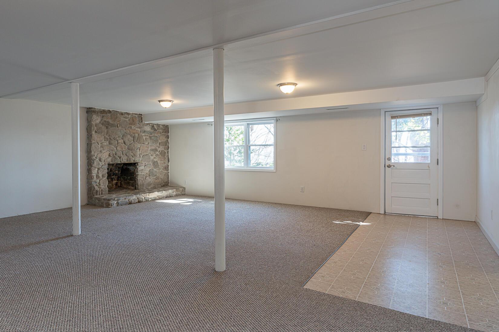 724 Eddies Road Salem, VA 24153 - Photo 35 of 54 an empty room with windows and fireplace