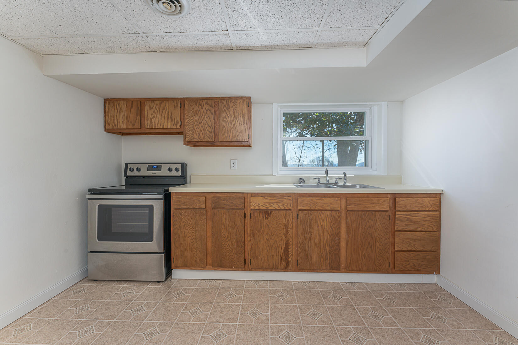 724 Eddies Road Salem, VA 24153 - Photo 42 of 54 a kitchen with a sink cabinets and window