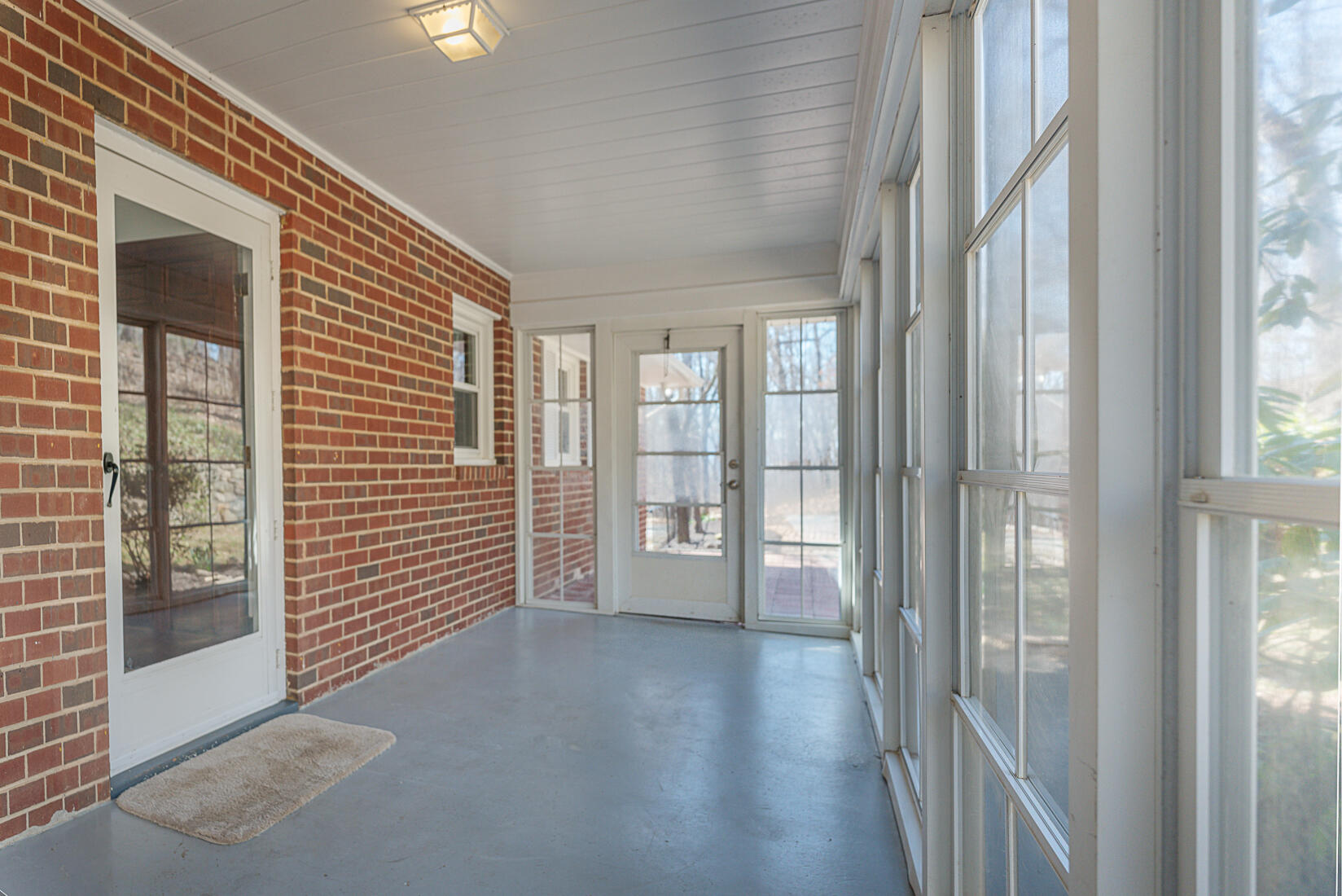 724 Eddies Road Salem, VA 24153 - Photo 6 of 54 a view of a hallway with wooden floor and windows
