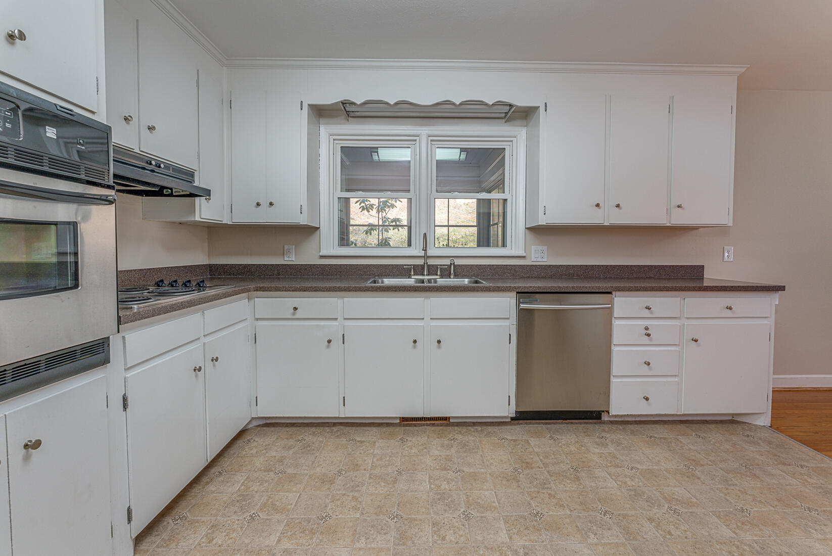 724 Eddies Road Salem, VA 24153 - Photo 9 of 54 a kitchen with granite countertop white cabinets white stainless steel appliances with a sink and dishwasher