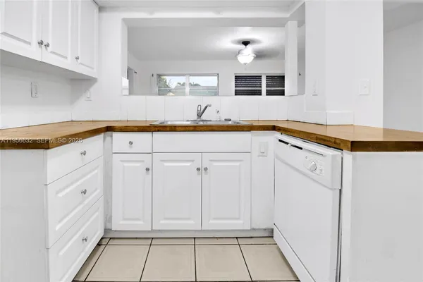 a view of a kitchen with cabinets