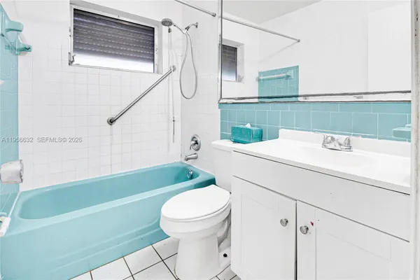 a bathroom with a sink a toilet and a bathtub