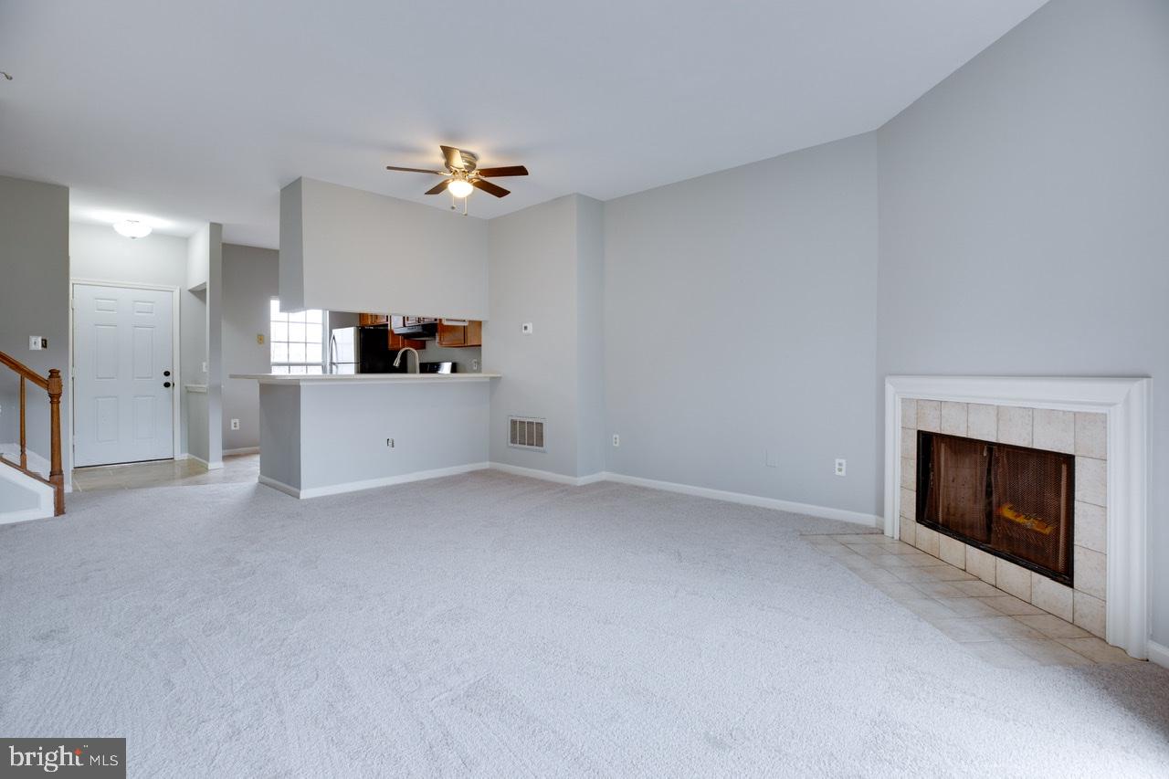 3005 McMaster Court Herndon, VA 20171 - Photo 12 of 26 a view of a livingroom with a fireplace and fan