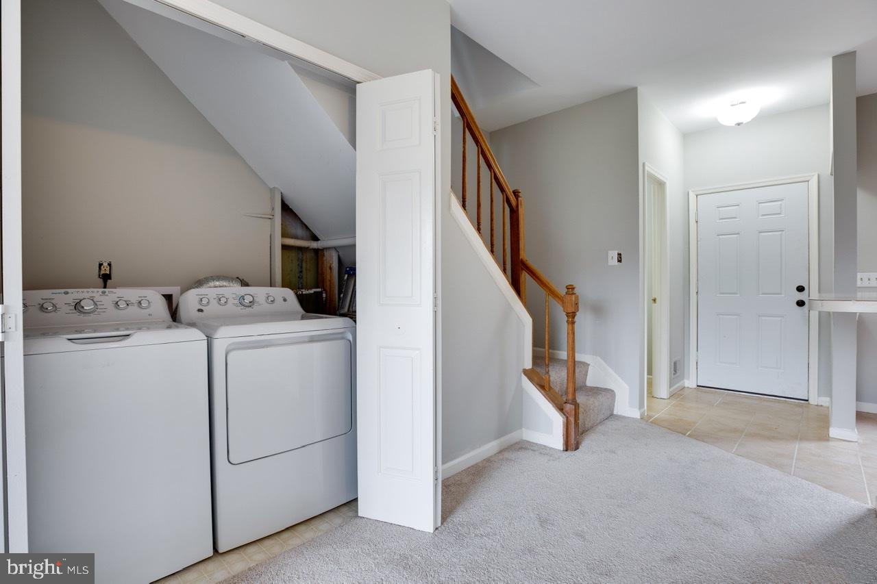3005 McMaster Court Herndon, VA 20171 - Photo 14 of 26 a view of storage and utility room with washer and dryer