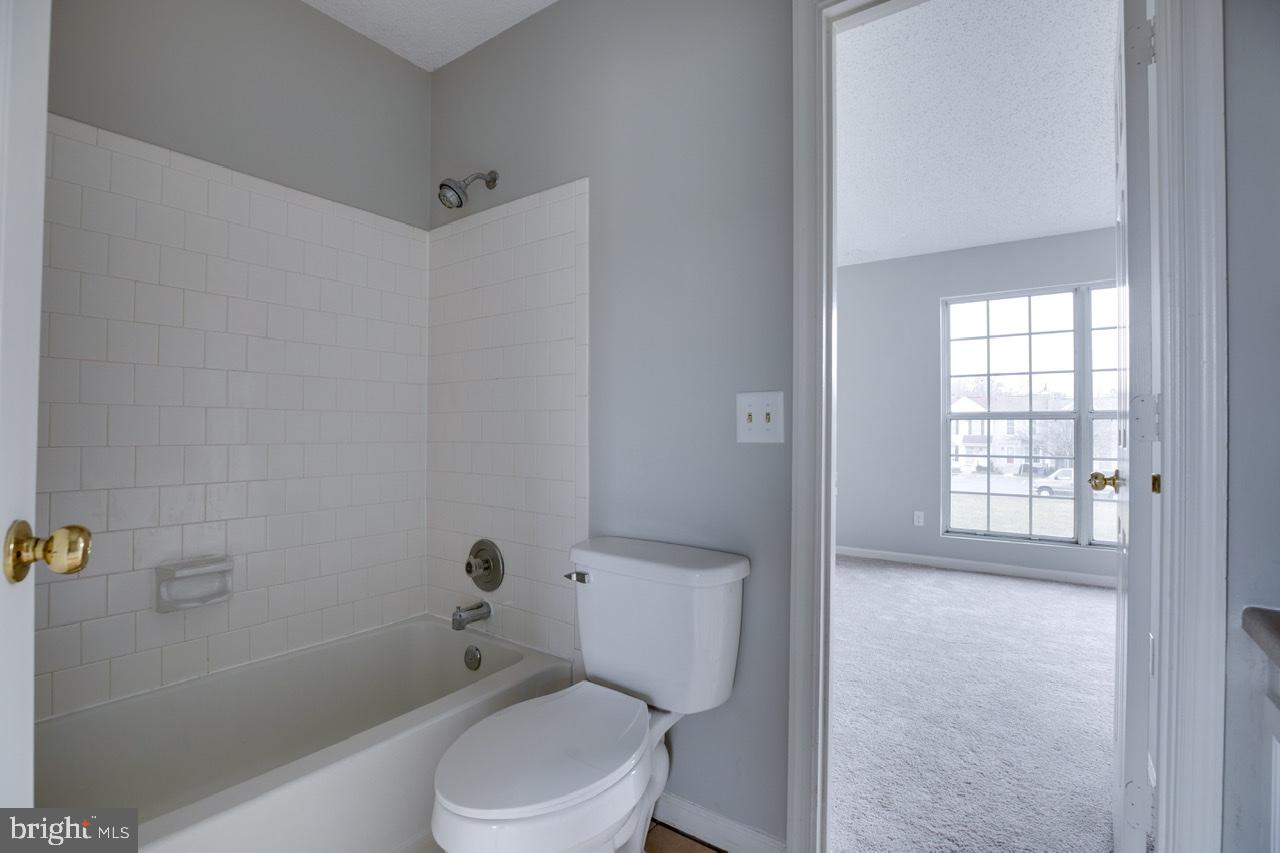 3005 McMaster Court Herndon, VA 20171 - Photo 21 of 26 a white toilet sitting next to a bath tub