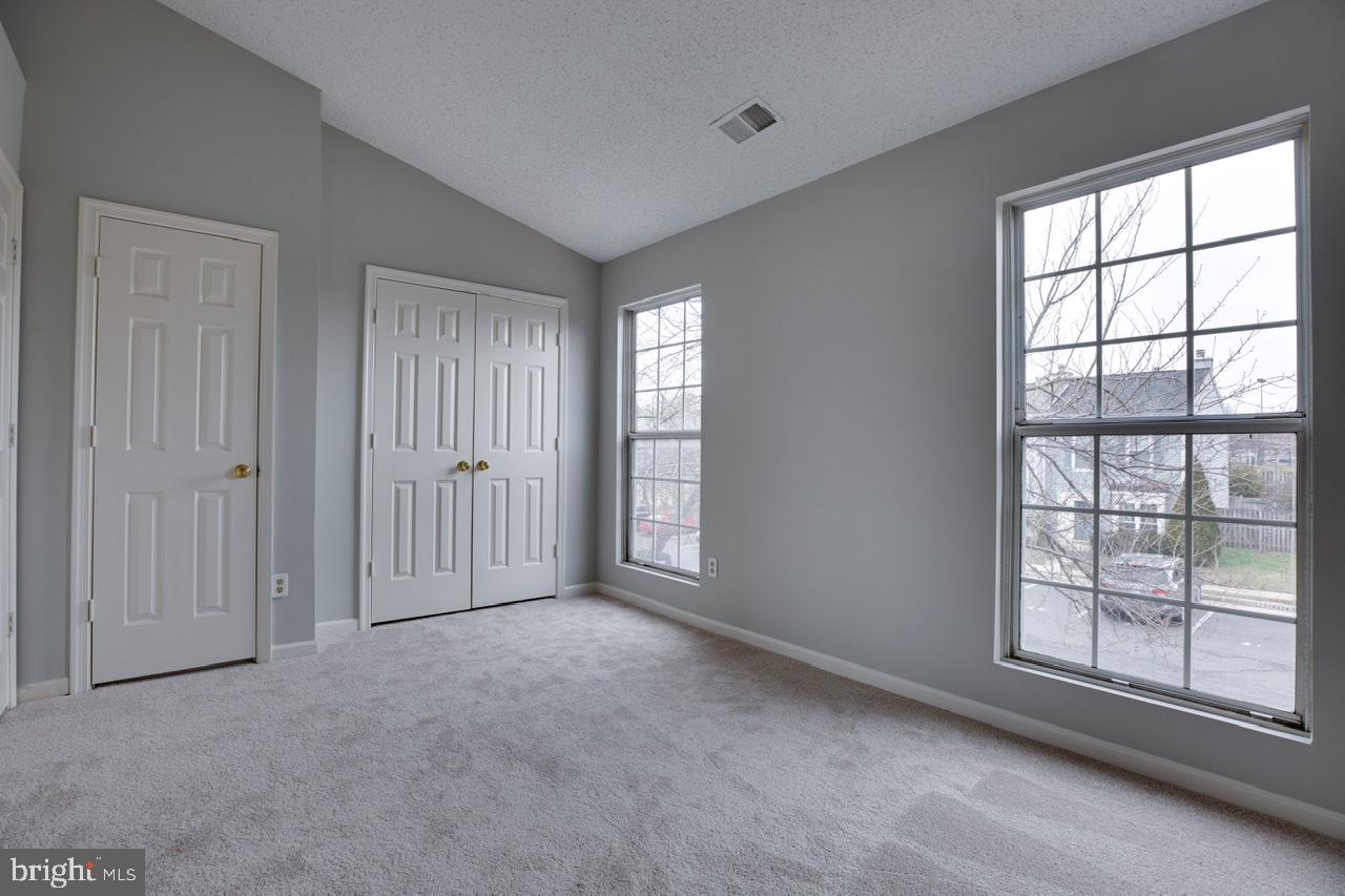 3005 McMaster Court Herndon, VA 20171 - Photo 22 of 26 an empty room with windows and closet