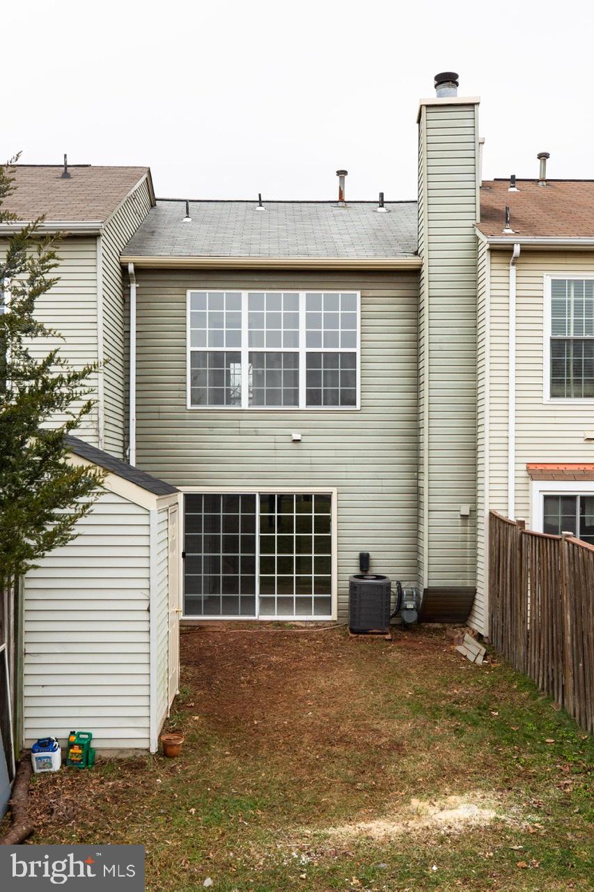 3005 McMaster Court Herndon, VA 20171 - Photo 24 of 26 a view of a blue house with a backyard
