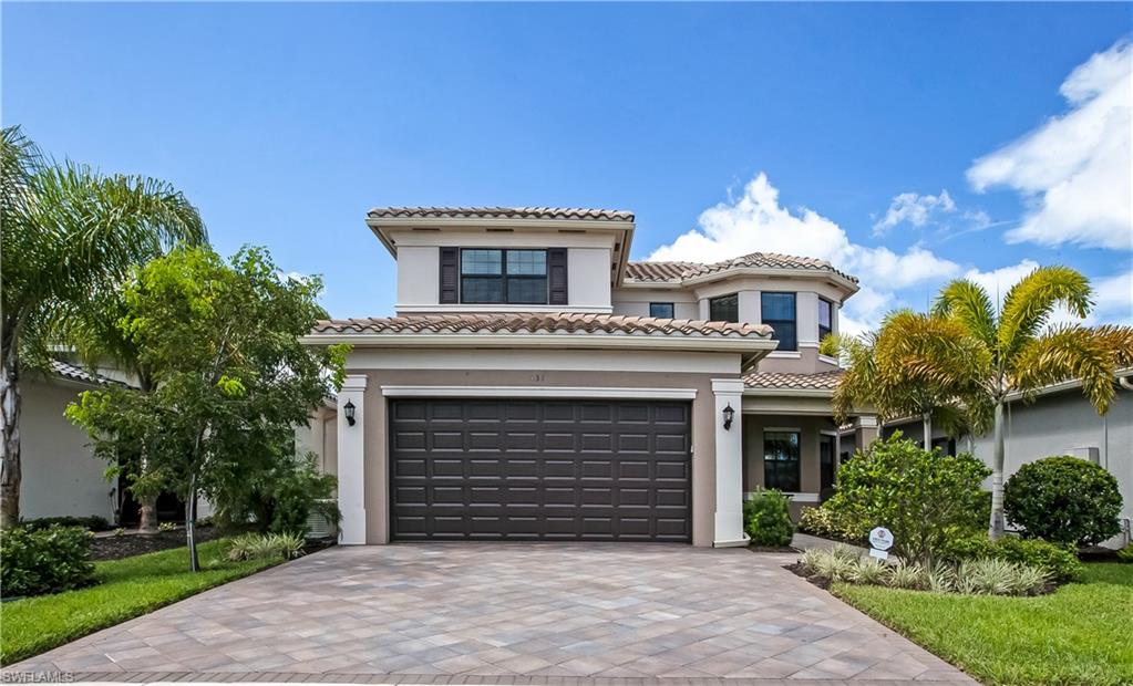 4310 Aurora Street Naples, FL 34119 - Photo 17 of 17 a front view of a house with a garden