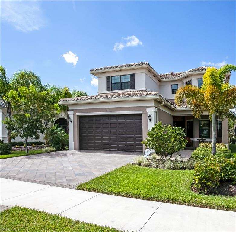 4310 Aurora Street Naples, FL 34119 - Photo 2 of 17 a view of house with yard and front view of a house