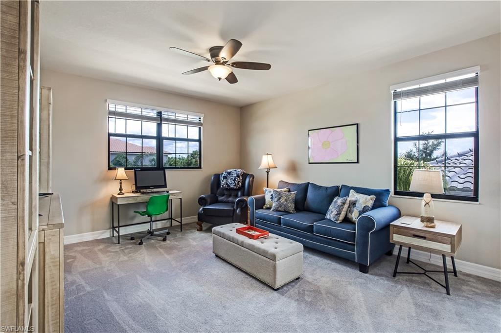 4310 Aurora Street Naples, FL 34119 - Photo 10 of 17 a living room with furniture and a window